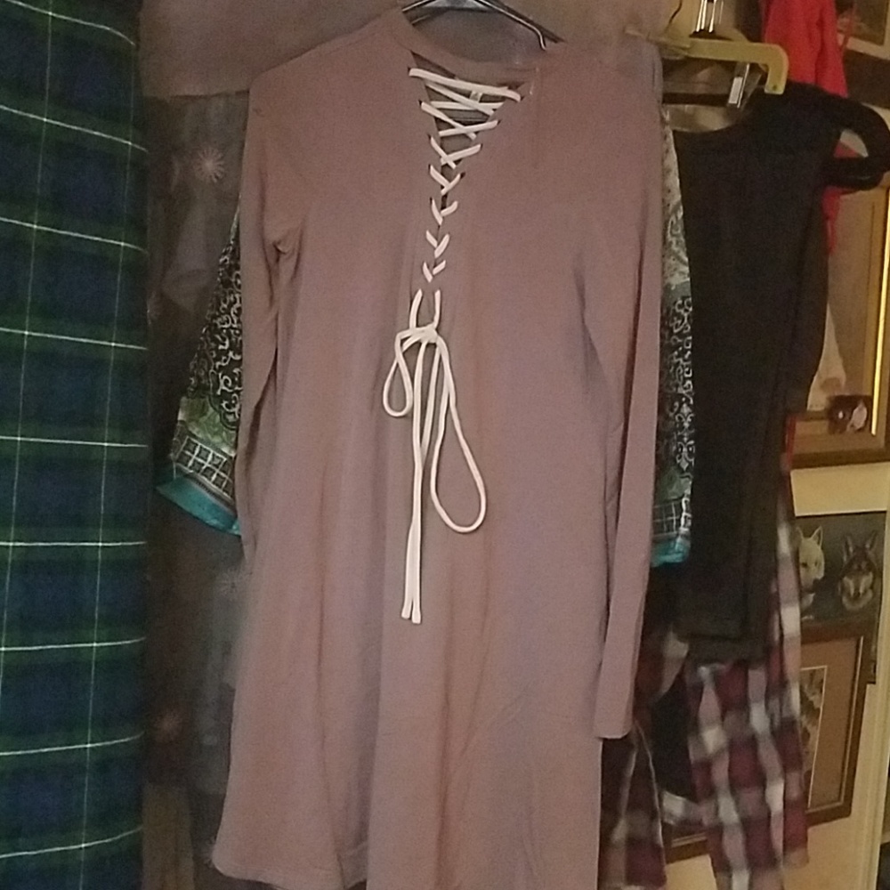Tunic style dress, with up ties, and pockets